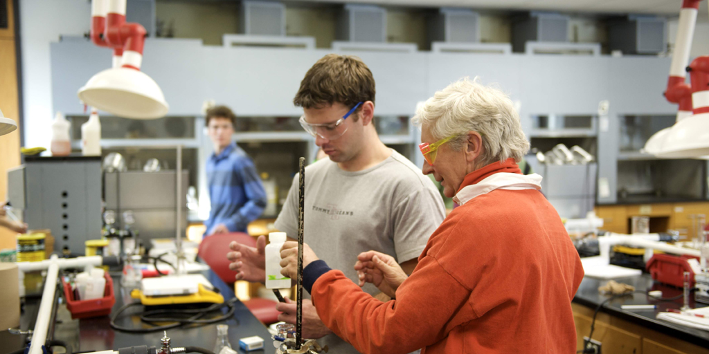 A student and professor in a chemistry lab