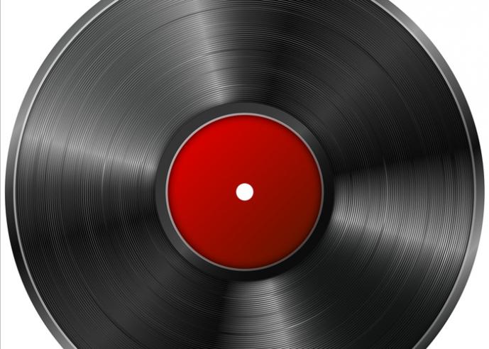A close-up of a vinyl record with red label.
